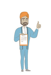 Image showing Hindu businessman with clipboard giving thumb up.