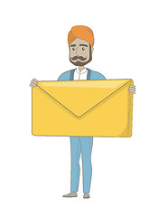 Image showing Hindu businessman holding a big envelope.