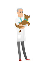 Image showing Senior caucasian veterinarian with dog in hands.