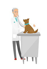 Image showing Senior caucasian veterinarian examining dog.