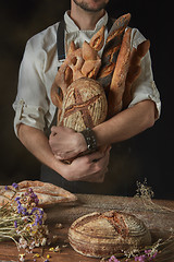 Image showing Baker keeps a variety of bread