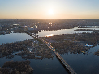 Image showing North bridge over the Dnieper River overlooking the Skaimol shopping center and Obolon district on the sunset