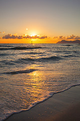 Image showing Brilliant ocean beach sunrise.