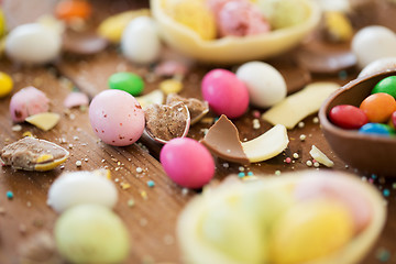 Image showing chocolate easter eggs and candy drops on table