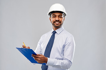 Image showing architect or businessman in helmet with clipboard