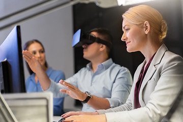 Image showing business team with computer working late at office