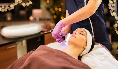 Image showing young woman having face microdermabrasion at spa