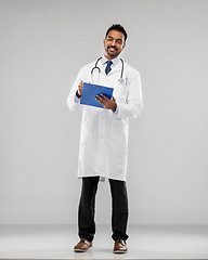 Image showing indian male doctor with clipboard and stethoscope