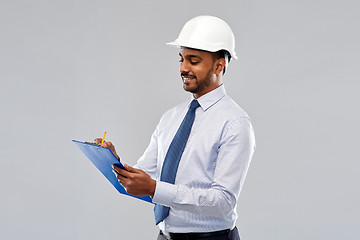 Image showing architect or businessman in helmet with clipboard