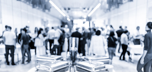 Image showing Blured image of businesspeople at coffee break at conference meeting.