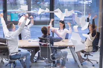 Image showing startup Group of young business people throwing documents