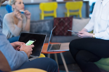 Image showing Young casual businessman using smartphone