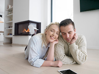 Image showing Young Couple using digital tablet on cold winter day