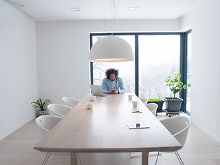 Image showing man using a mobile phone  at home