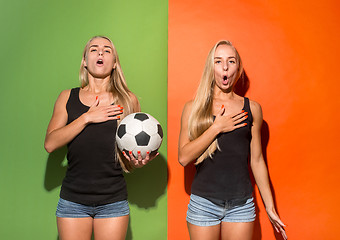 Image showing Fan sport woman player holding soccer ball