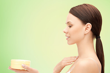 Image showing beautiful woman with moisturizing cream