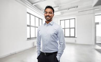 Image showing indian businessman or realtor in empty office room