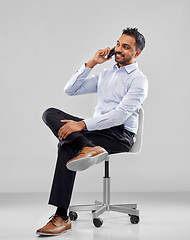 Image showing indian businessman calling on smartphone