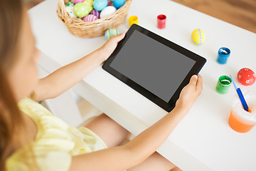 Image showing girl with tablet computer, easter eggs and colors