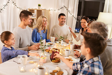 Image showing happy family having tea party at home