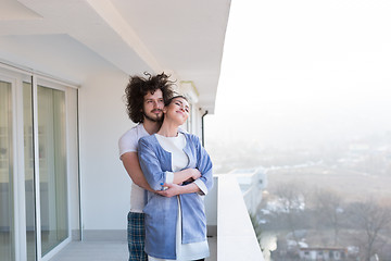 Image showing Couple hugging on the balcony