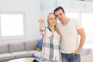 Image showing couple showing a keys of their new house