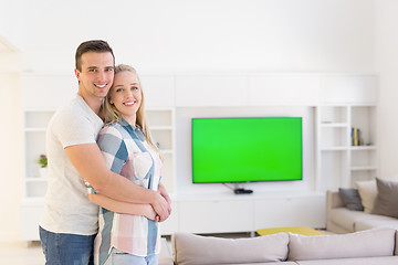 Image showing couple hugging in their new home