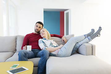 Image showing couple hugging and relaxing on sofa