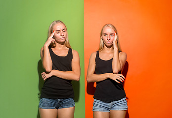 Image showing Women having headache over studio background.