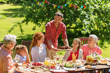 Image showing happy family having dinner or summer garden party