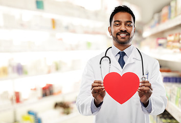 Image showing smiling indian male doctor with red heart shape