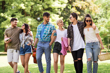 Image showing friends with guitar and picnic blanket at park