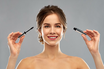 Image showing woman with mascara applying make up