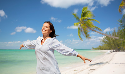 Image showing happy woman over tropical beach background