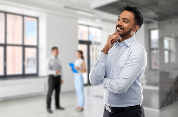 Image showing indian businessman or realtor in empty office room