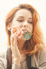 Image showing picture of young and beautiful woman with flower