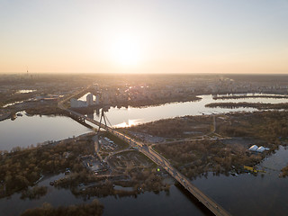 Image showing The bridge over the Dnieper River and a panoramic view of the city of Kiev at sunset.