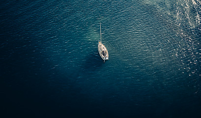 Image showing Overhead views ofa small yacht on the water