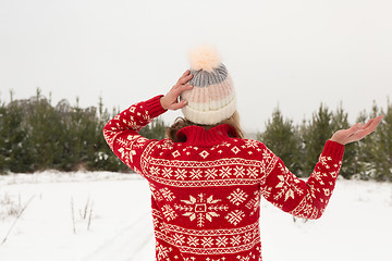 Image showing Female standing in a winter landscape covered in snow