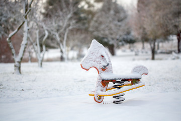Image showing Child playground equipment covered in snow in Oberon