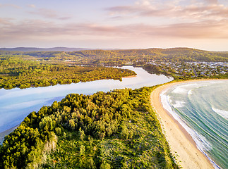 Image showing Early morning light over coastal beaches and river