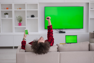 Image showing young man in bathrobe enjoying free time