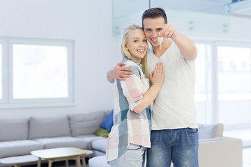 Image showing couple showing a keys of their new house