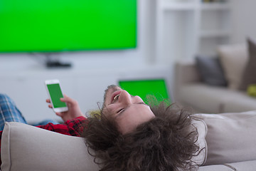 Image showing young man in bathrobe enjoying free time