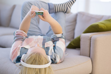 Image showing girl enjoying music through headphones