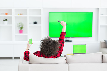 Image showing young man in bathrobe enjoying free time