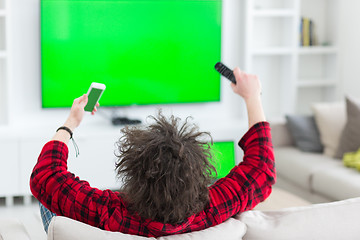 Image showing young man in bathrobe enjoying free time