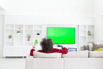 Image showing young man in bathrobe enjoying free time