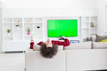 Image showing young man in bathrobe enjoying free time