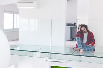 Image showing young freelancer in bathrobe working from home